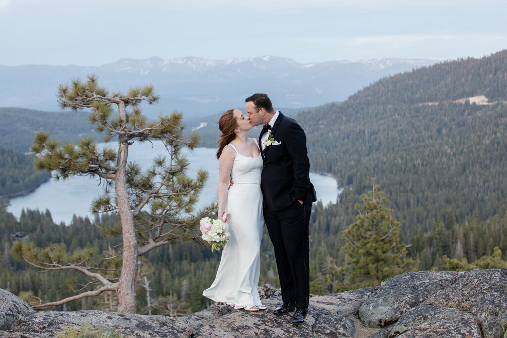 bride and groom kissing at donner lake overlook in lake tahoe