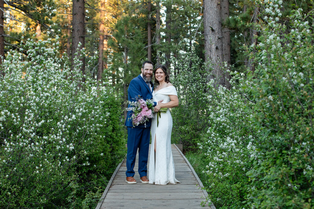 smiley bride and groom in skylandia park during their lake tahoe elopement