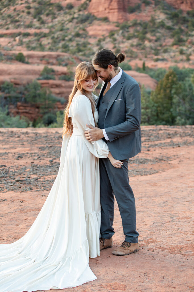 sweet elopement couple hugging and sharing an intimate moment together in Sedona