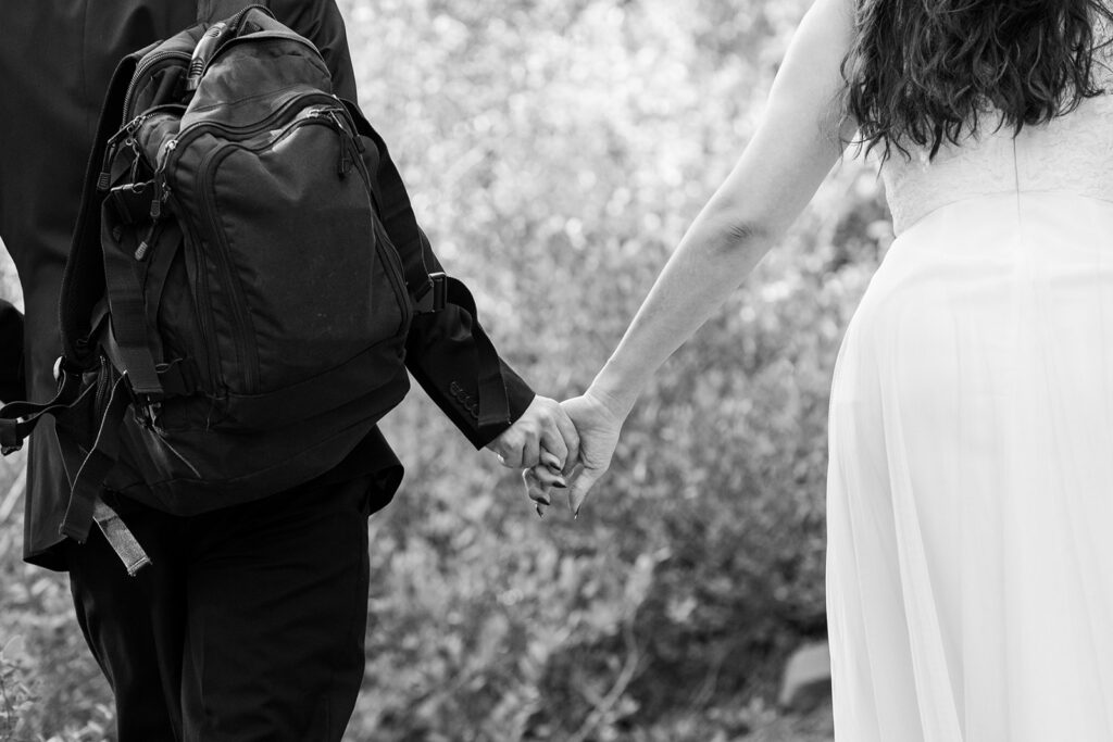 elopement couple hiking to Eagle Rock for their beautiful, simple elopement day