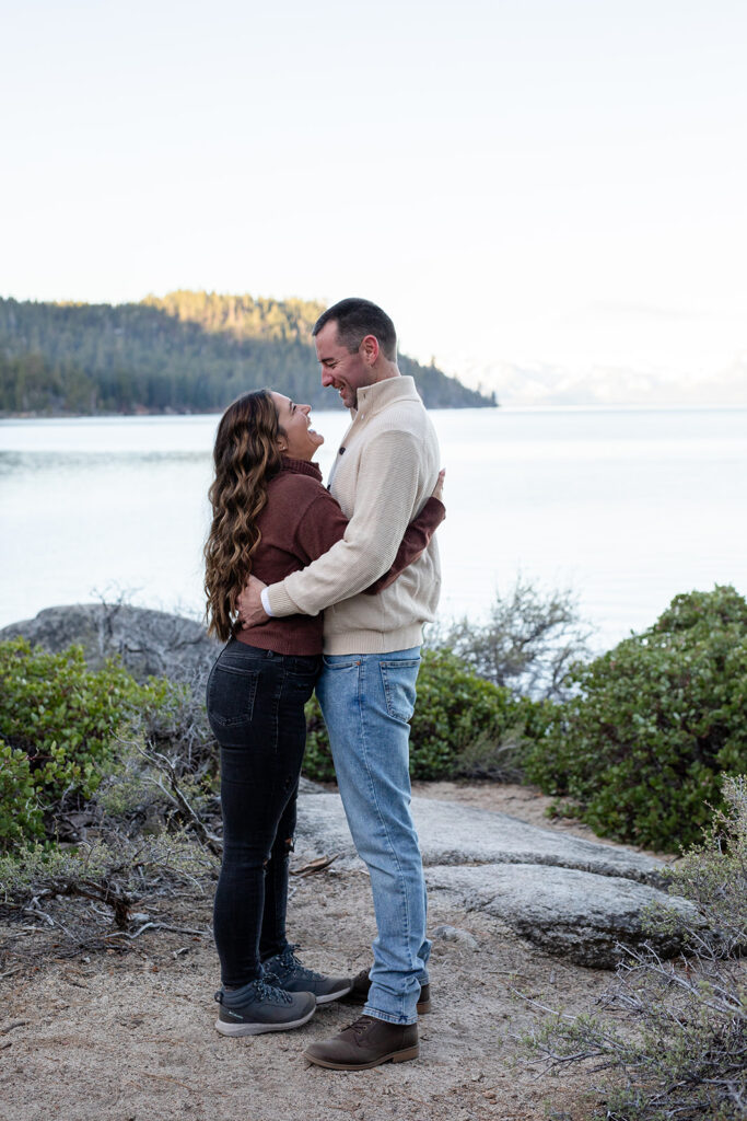 playful couple at secret cove for their lake tahoe engagement session