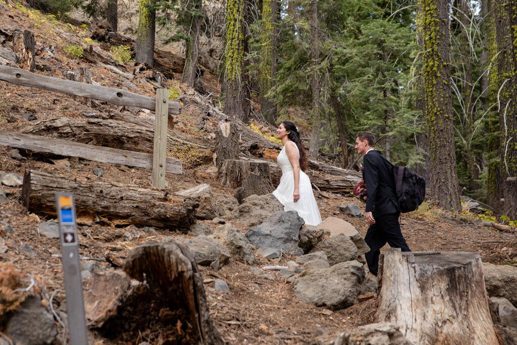bride and groom hiking together during their lake tahoe elopement