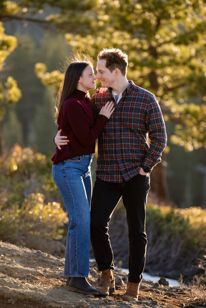 Eagle Rock engagement photos Framed by golden trees and backlit by sunset, the couple stands close, smiling and gazing into each other’s eyes
