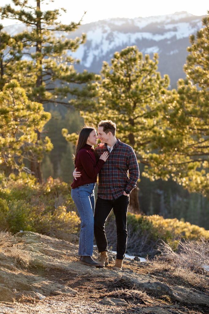 Eagle Rock engagement photos Framed by golden trees and backlit by sunset, the couple stands close, smiling and gazing into each other’s eyes