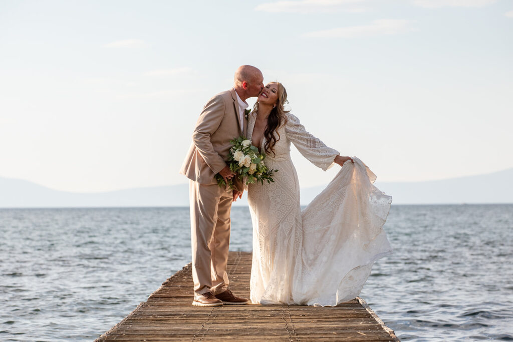 bride and groom on the dock at Lake Tahoe with stunning water views