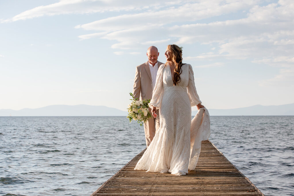 bride and groom on the dock at Lake Tahoe with stunning water views