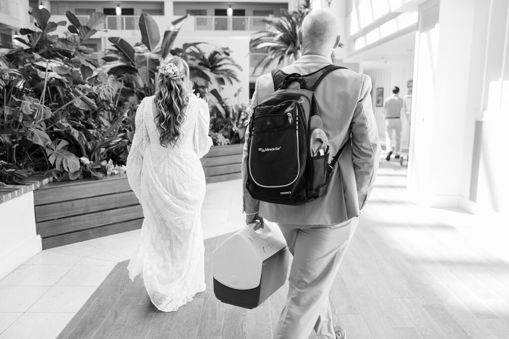 bride and groom walking through the lobby of Margaritaville Resort, South Lake Tahoe