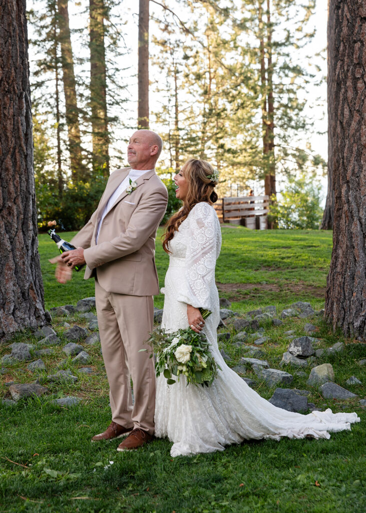 bride and groom popping champagne in Lake Tahoe