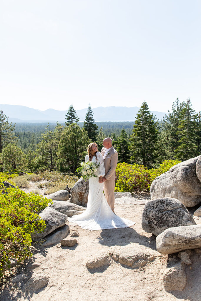 sweet bride and groom moments in Lake Tahoe with forest and mountain views in the background