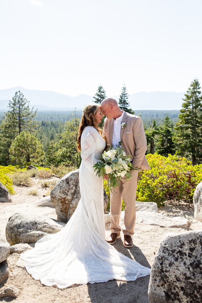 sweet bride and groom moments in Lake Tahoe with forest and mountain views in the background