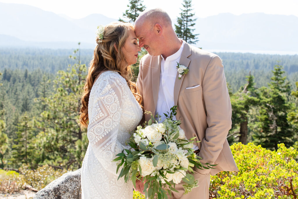 sweet bride and groom moments in Lake Tahoe with forest and mountain views in the background