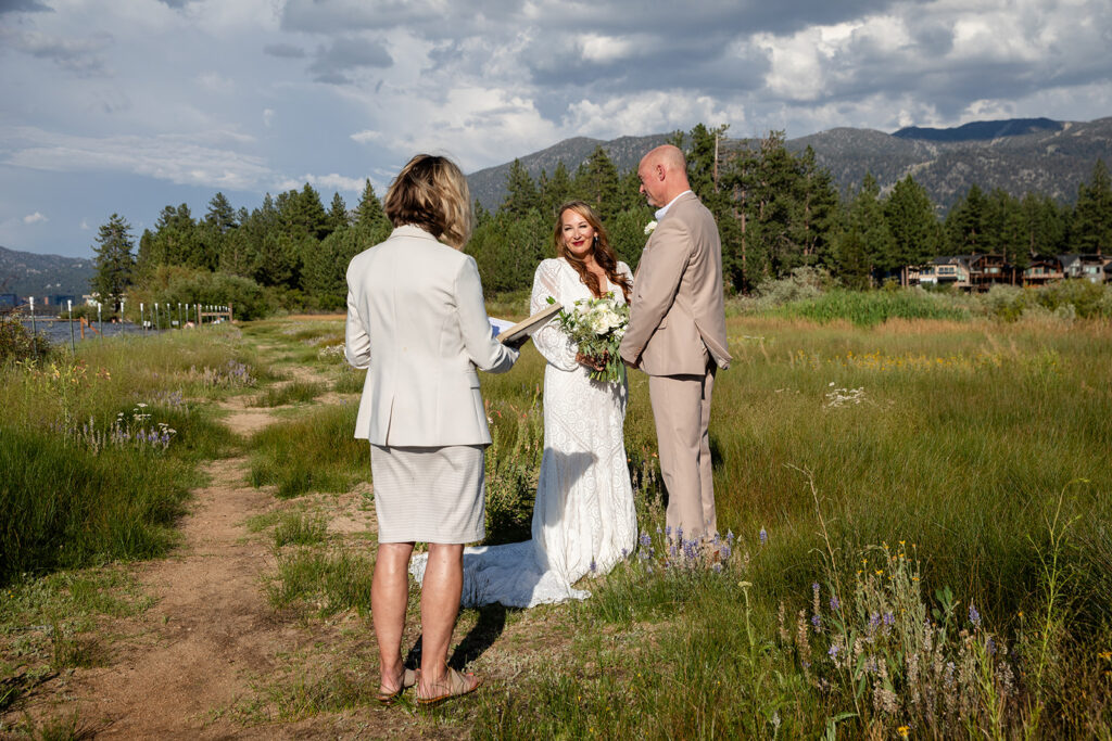 lake tahoe elopement ceremony in a meadow with mountain and foresty views in the backdrop