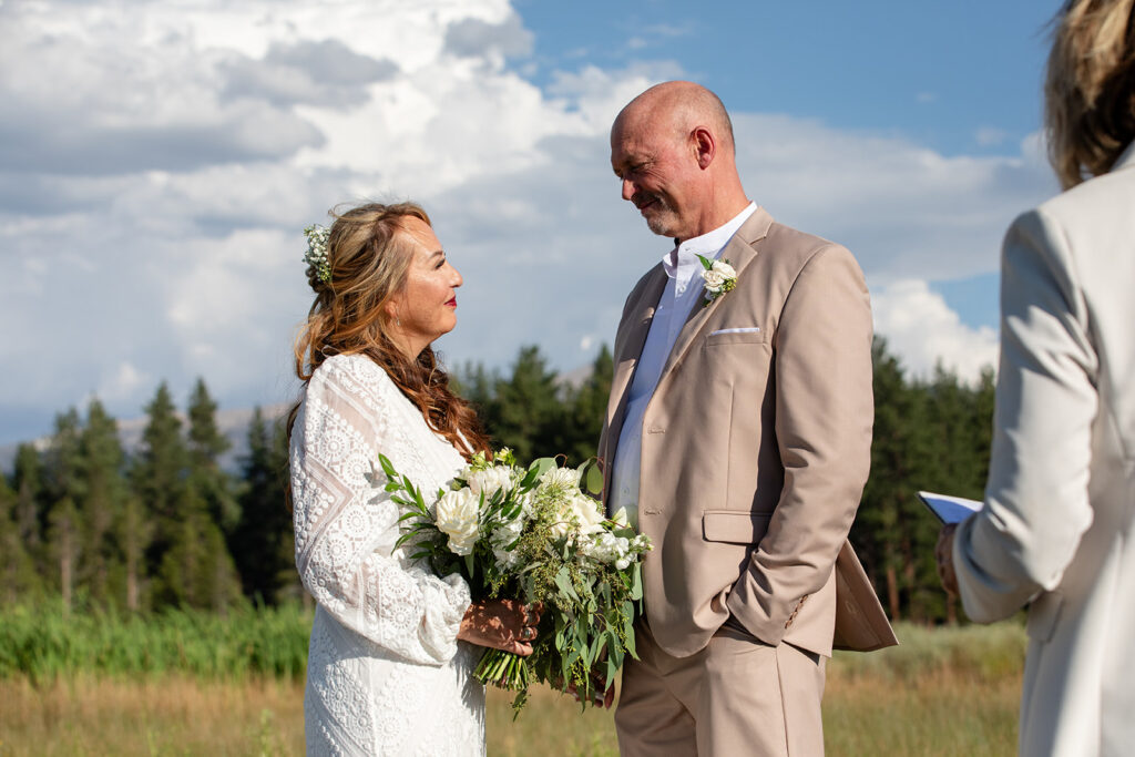 lake tahoe elopement ceremony in a meadow with mountain and foresty views in the backdrop