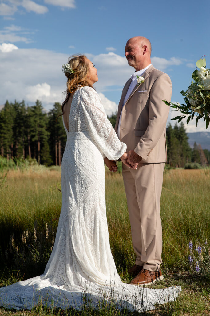 lake tahoe elopement ceremony in a meadow with mountain and foresty views in the backdrop