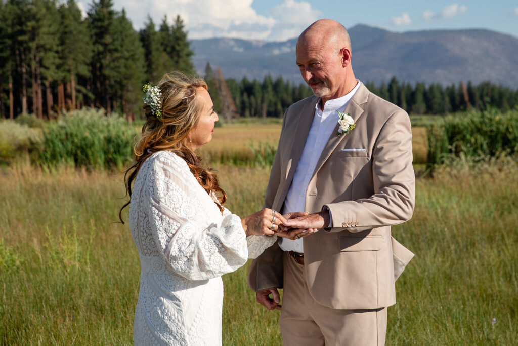 lake tahoe elopement ceremony in a meadow with mountain and foresty views in the backdrop