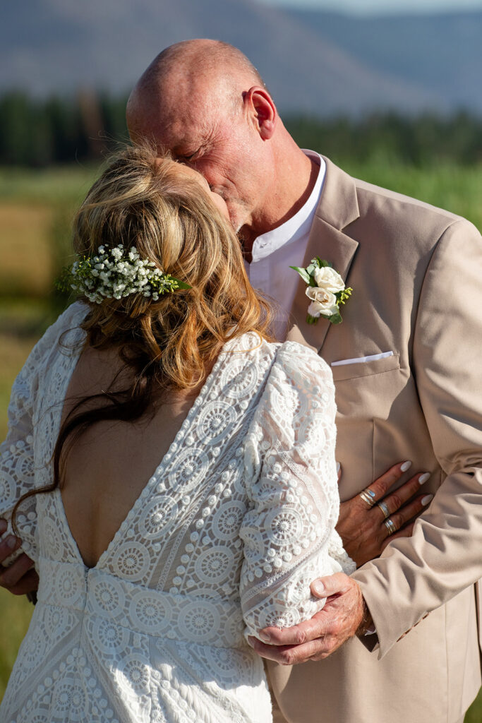 first kiss during a lake tahoe elopement ceremony at mark twain beach