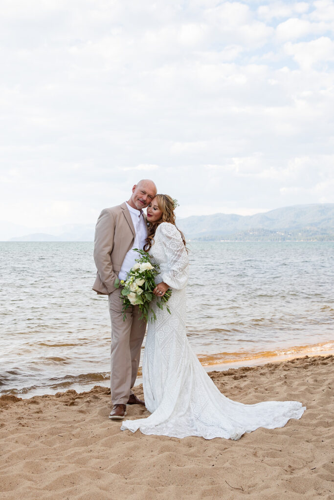sweet and playful bride and groom at lake tahoe beach elopement locations