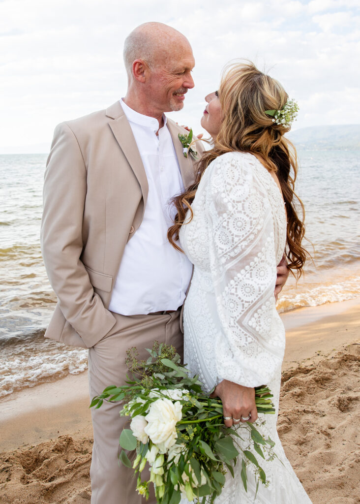 sweet and playful bride and groom at lake tahoe beach elopement locations