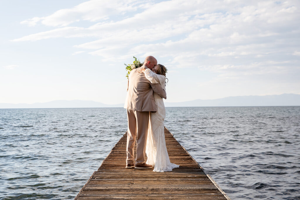 bride and groom on the dock at Lake Tahoe with stunning water views