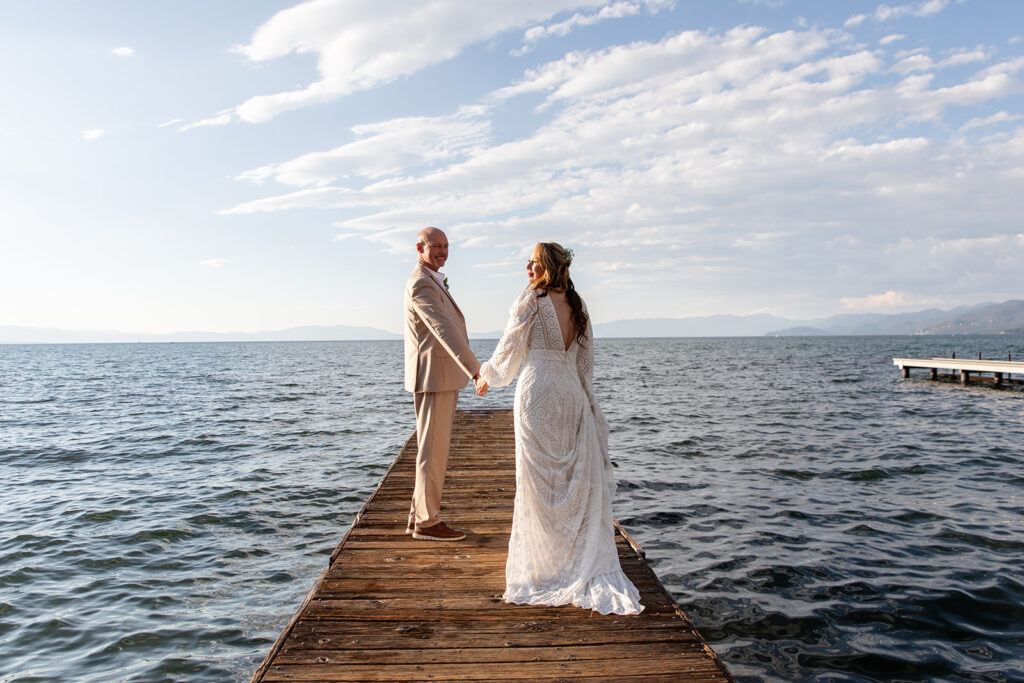 bride and groom on the dock at Lake Tahoe with stunning water views