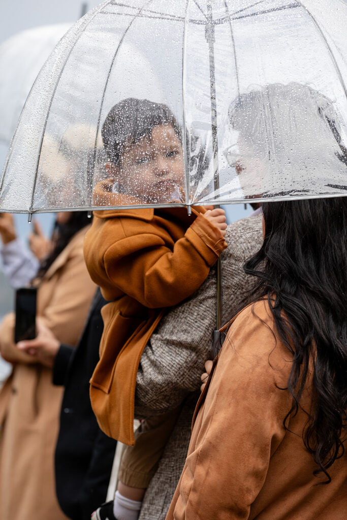 family under a clear umbrella