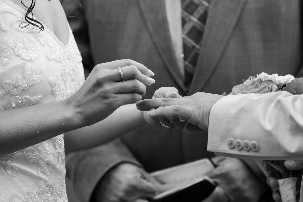 bride and groom exchanging rings