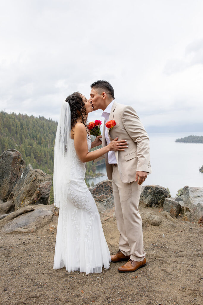 romantic rainy elopement kiss at emerald bay, lake tahoe
