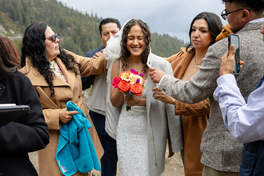 happy bride during a rainy emerald bay elopement in lake tahoe