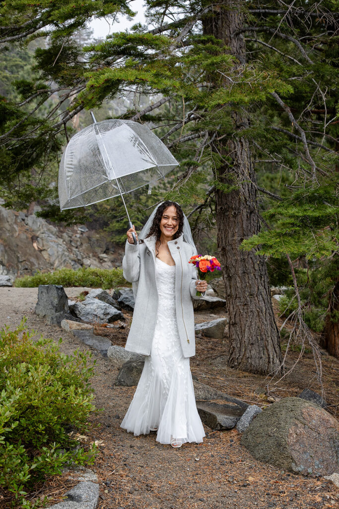 bride under a clear umbrella