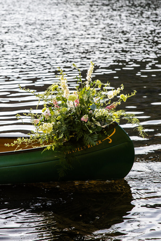 Close-up of canoe decorated with flowers for a Lake Tahoe elopement photography session