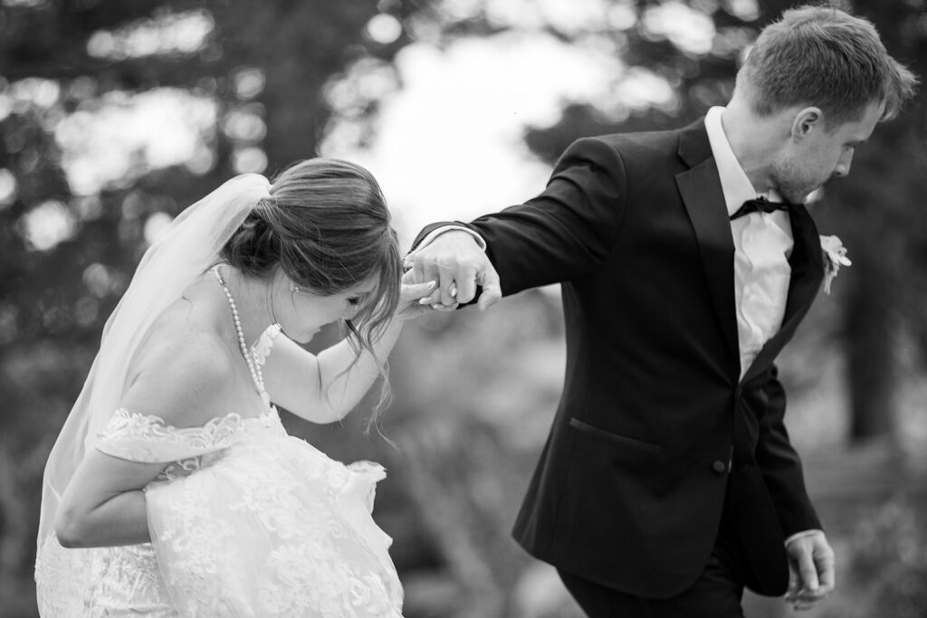 bride and groom walking hand in hand 