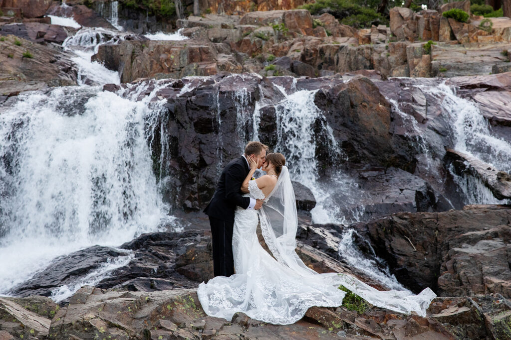 Waterfall backdrop at Glen Alpine Falls during Tahoe wedding photo session.