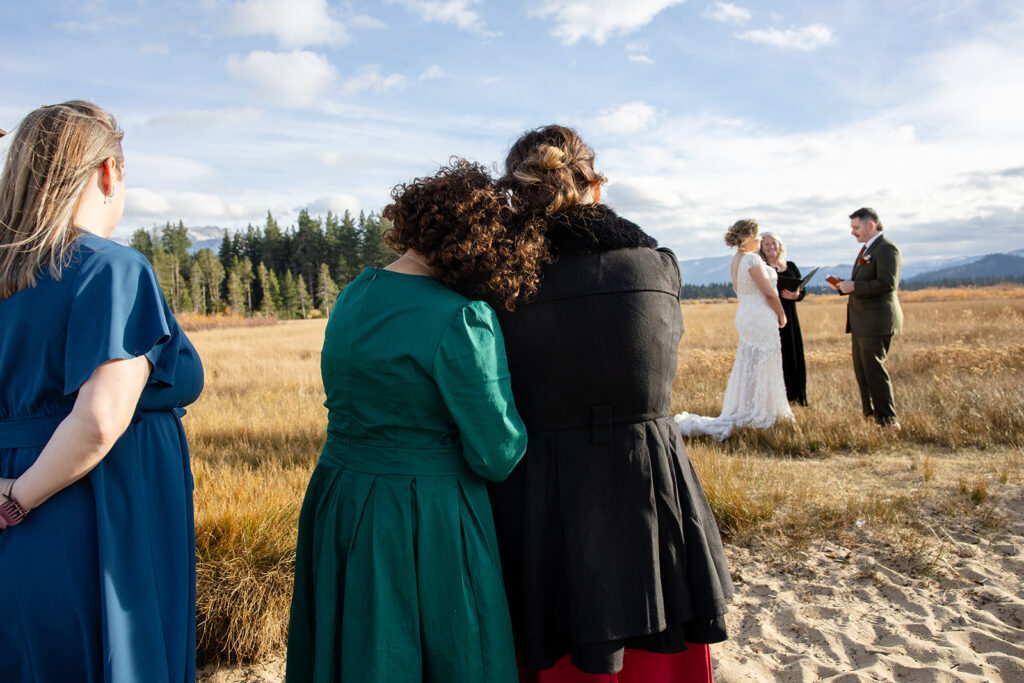 guests snuggled up together witnessing the elopement ceremony
