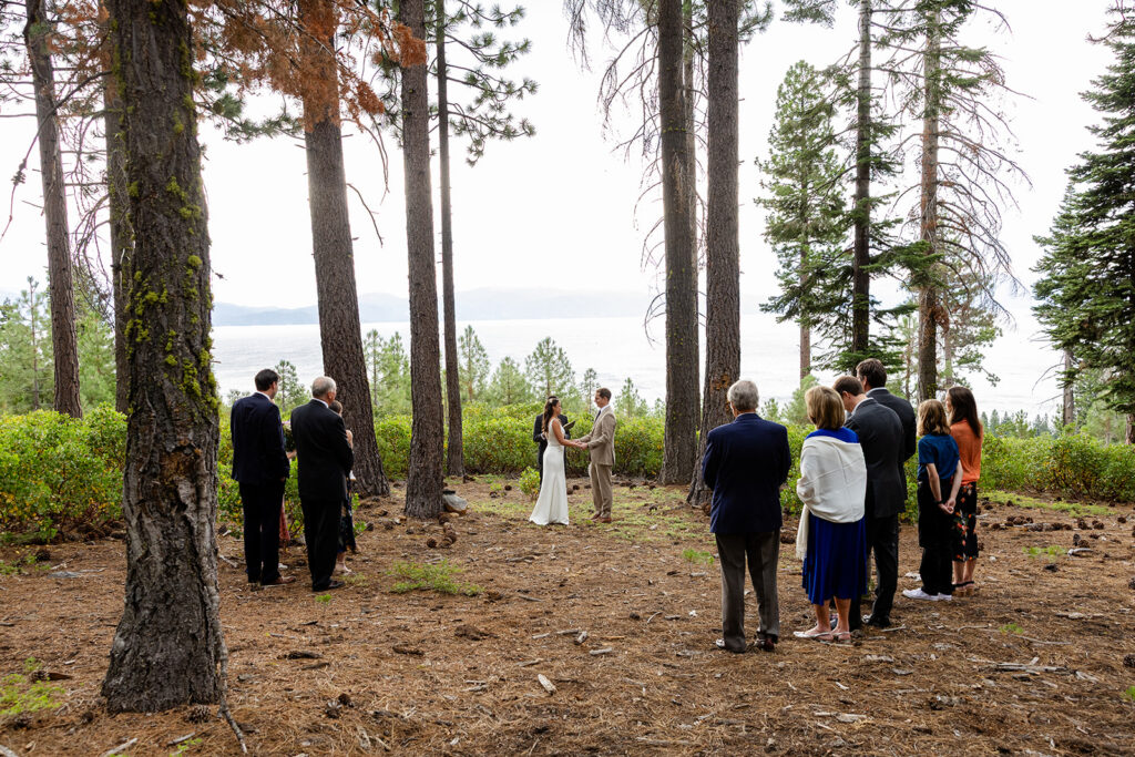 lake tahoe forest elopement ceremony with lake views surrounded by closest loved ones