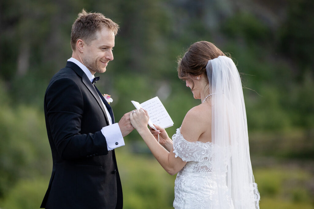 bride and groom holding hands and exchanging vows