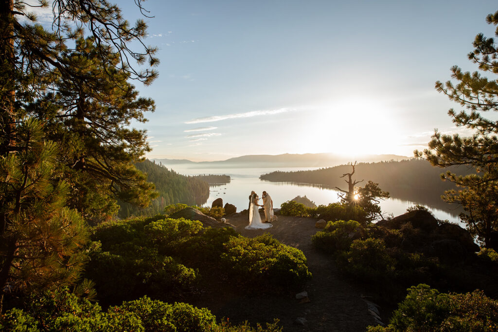 golden hour elopement ceremony in lake tahoe overlooking the lake surrounded by lush greenery