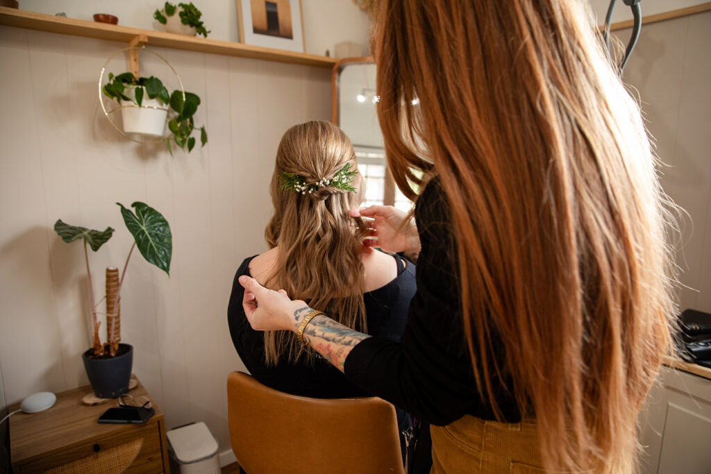 bride getting her hair and make up done ahead of the elopement