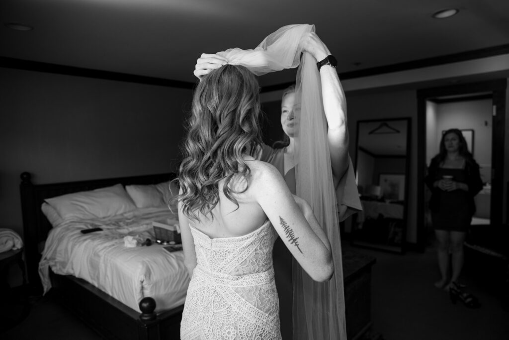bride getting ready surrounded by family