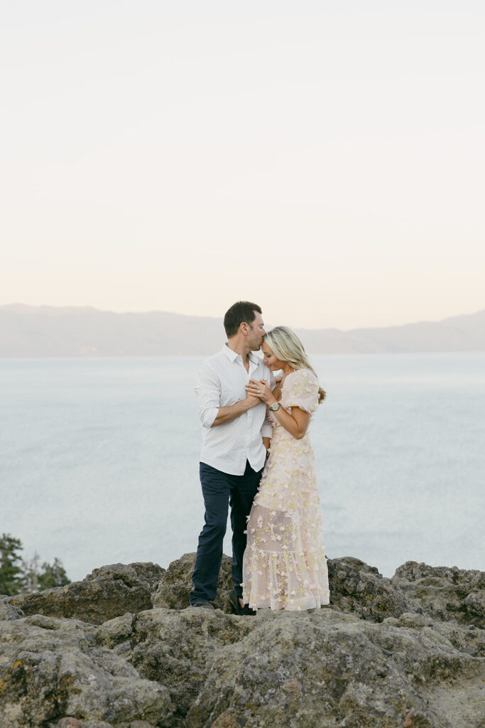 couple hugging during their mountain engagement photoshoot in lake tahoe