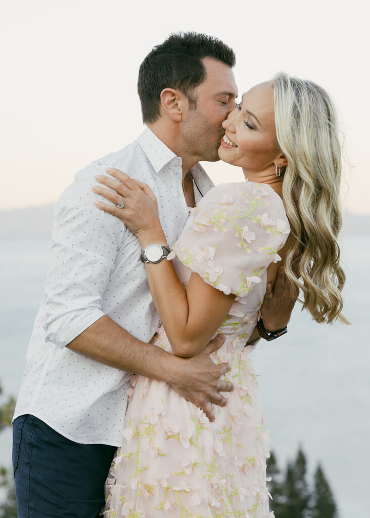 couple hugging during their mountain engagement photoshoot in lake tahoe