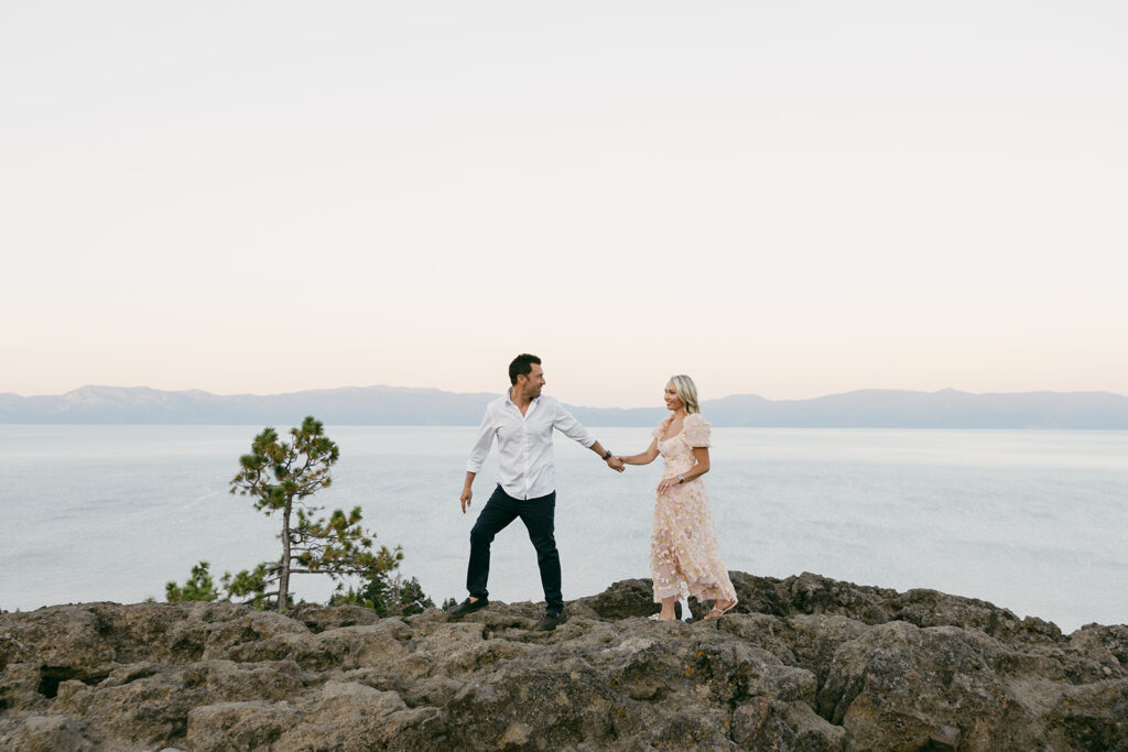 couple walking hand in hand during their mountain engagement photoshoot in lake tahoe