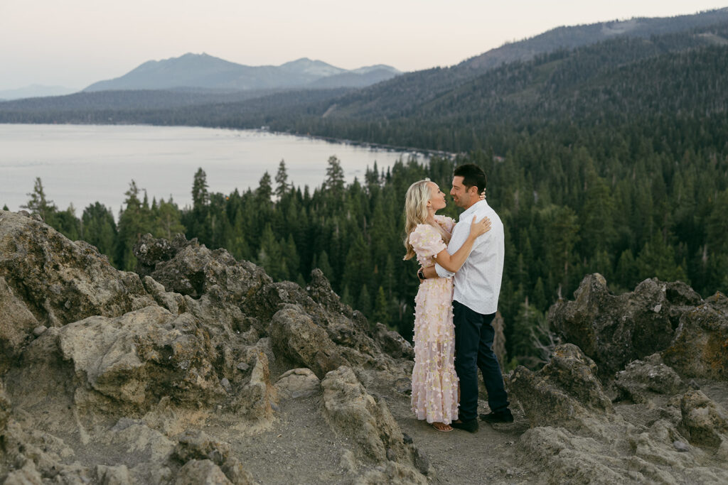 couple hugging during their mountain engagement photoshoot in lake tahoe