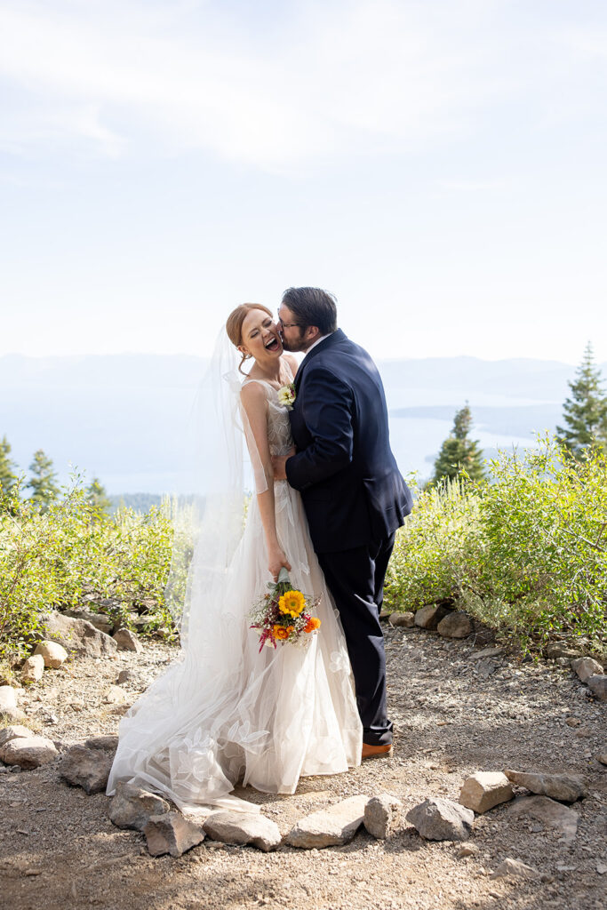 playful bride and groom photos at a mountain overlook during their adventure elopement in Lake Tahoe