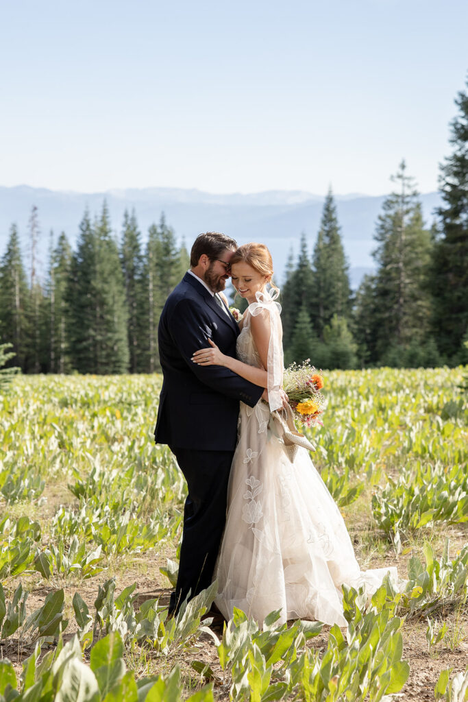bride and groom roaming around the meadow during their lake tahoe adventure elopement