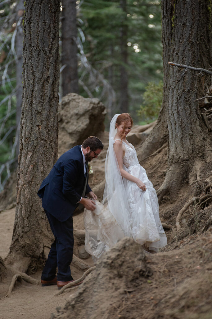 bride and groom roaming around the forest during their lake tahoe adventure elopement