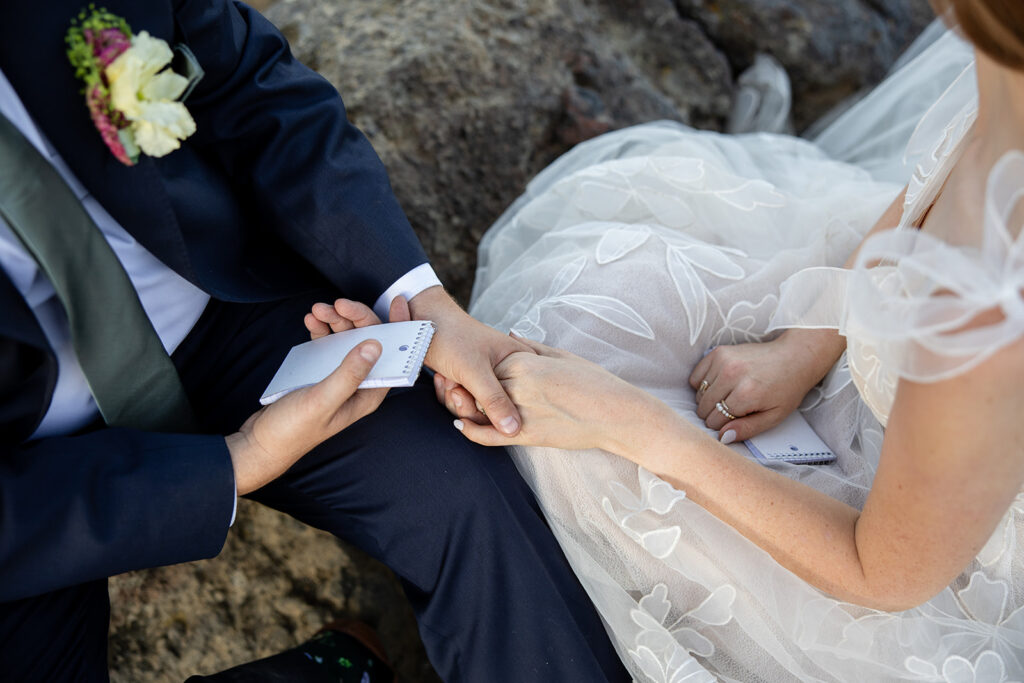 bride and groom exchanging private vows during their adventure elopement at a lake tahoe mountain overlook