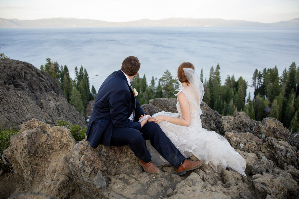 bride and groom exchanging private vows during their adventure elopement at a lake tahoe mountain overlook