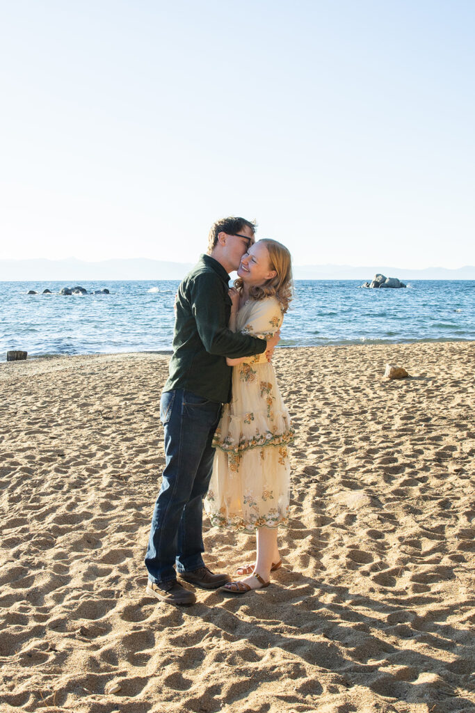 romantic engagement photos at the beach of zephyr cove