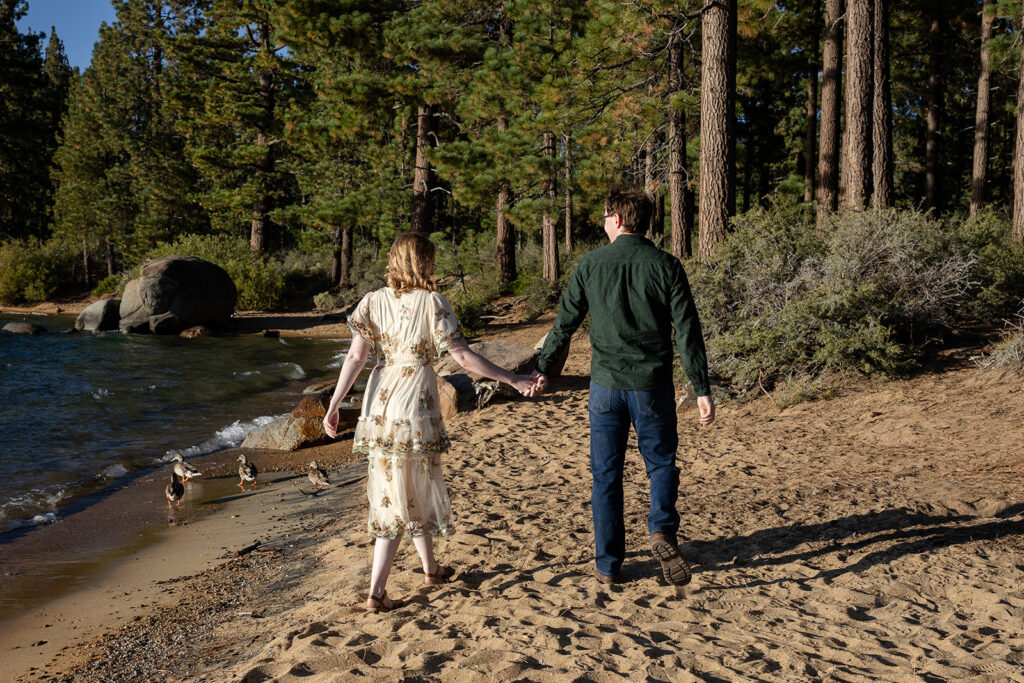 playful, romantic engagement photos at the beach of zephyr cove