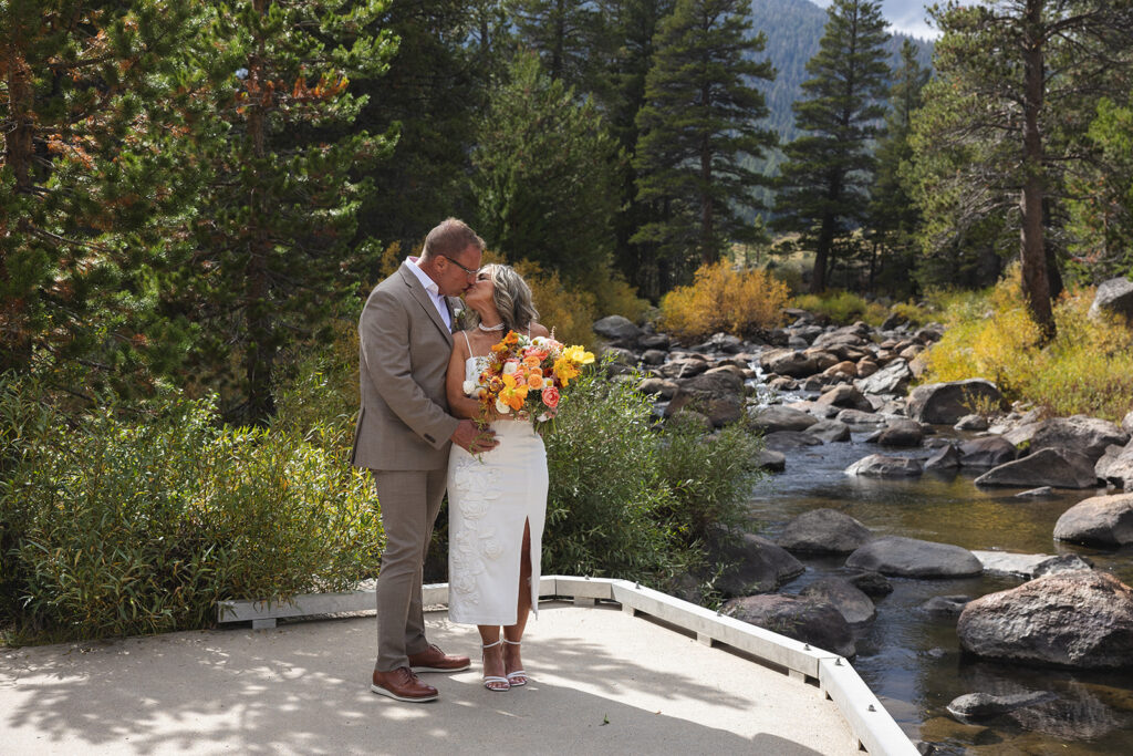bride and groom by a cute pond in lake tahoe